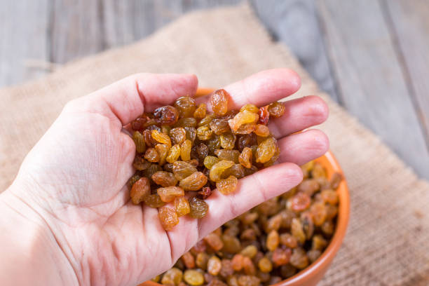 istock Sweet raisins in hand 650183808