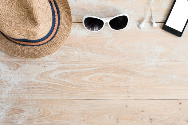 istock Straw hat and sunglasses on wood 650183832