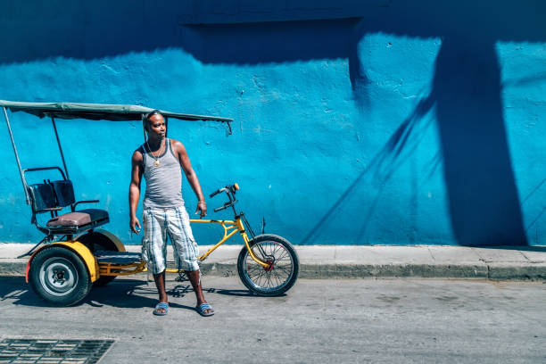 istock Bicycle taxi driver with his vehicle, Cuba 650194516