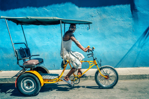 istock Bicycle taxi driver with his vehicle, Cuba 650194532