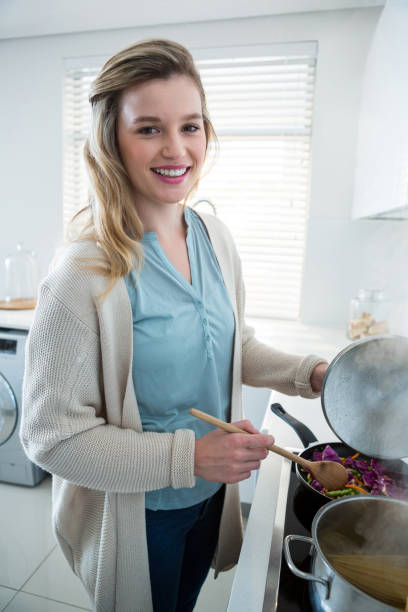 istock Woman cooking food in kitchen 650196370