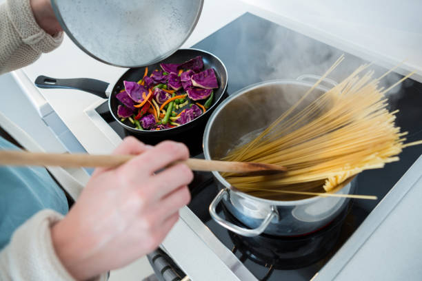 istock Woman cooking food in kitchen 650196426