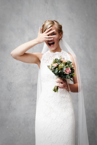 Beauty bride in shock Beauty bride in shock looking at camera flower girl stock pictures, royalty-free photos & images