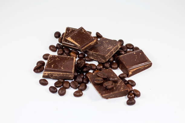 istock pieces of chocolate with coffee beans on a white background 650197704