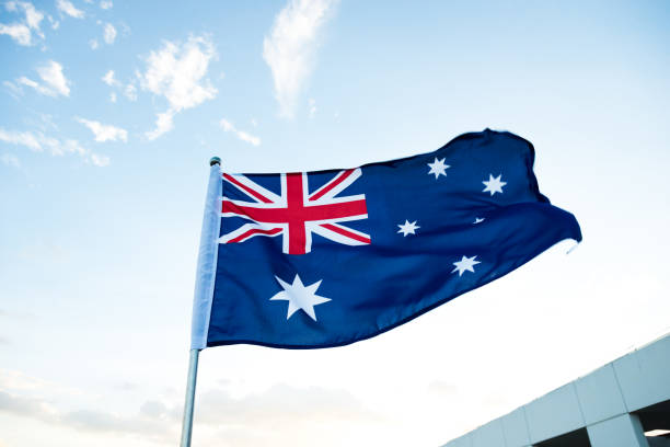 australien flagge winken - australia australia day celebration flag stock-fotos und bilder