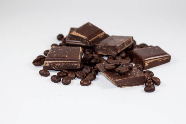 istock pieces of chocolate with coffee beans on a white background 650206494