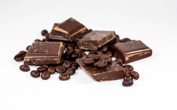 istock pieces of chocolate with coffee beans on a white background 650218958