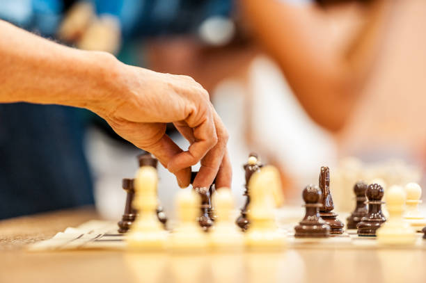 istock Senior Man Playing Chess At The Community Center 650219100