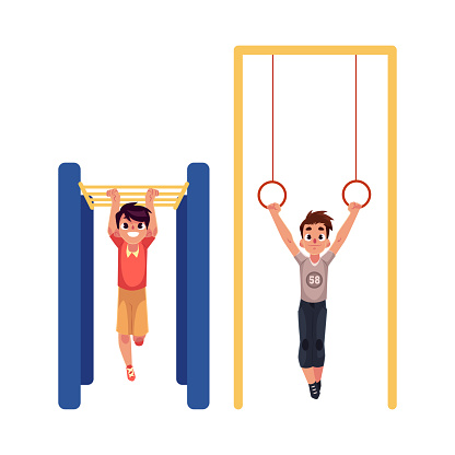 Boys hanging on gymnastic rings and monkey bars at playground