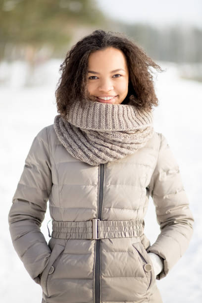 istock Positive woman in warm jacket standing in forest 650223502