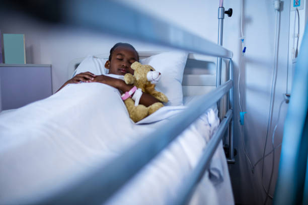 istock Patient sleeping with teddy bear on the bed 650229606