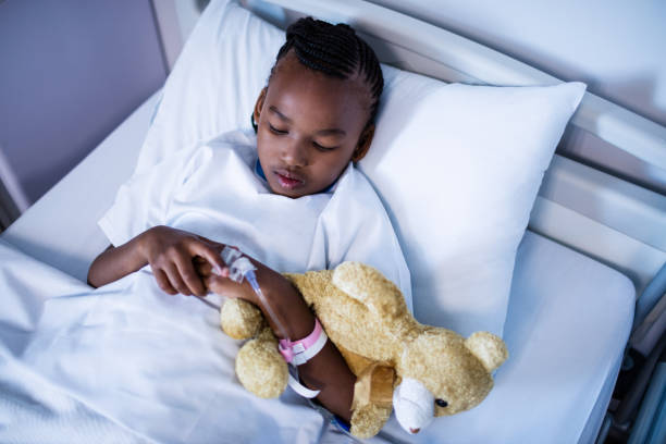 istock Patient sleeping with teddy bear on the bed at hospital 650230042