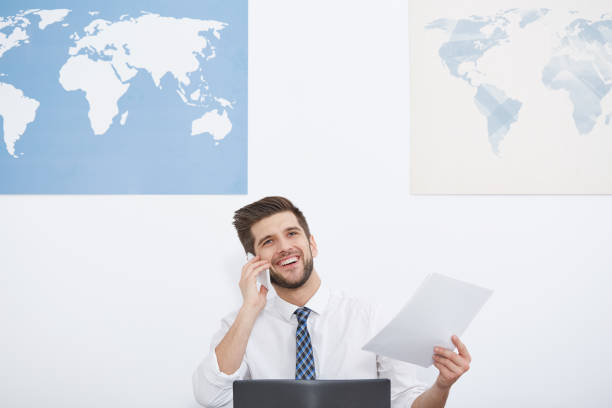 istock Happy businessman talking on phone 650230648