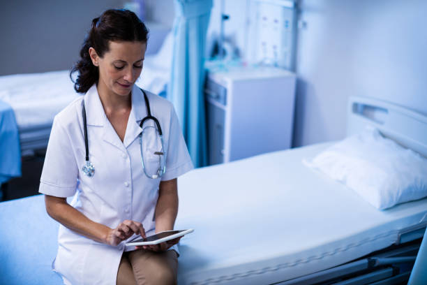istock Female doctor using digital tablet in ward 650233576
