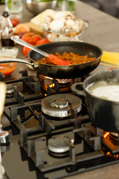 istock Minced meat in saucepan on stove and pasta cooking 650238322