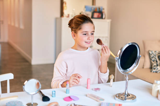 istock Little girl doing their very first make up 650238848