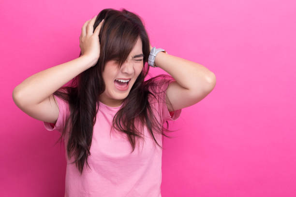 istock Angry woman screaming out and pulling her hair 650246294
