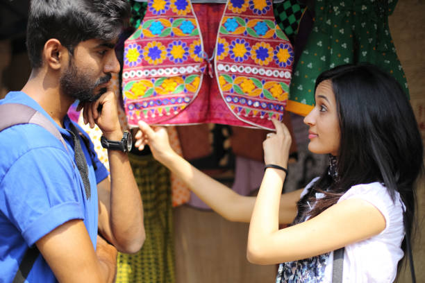 istock Couple Engage in Street Shopping 650247362