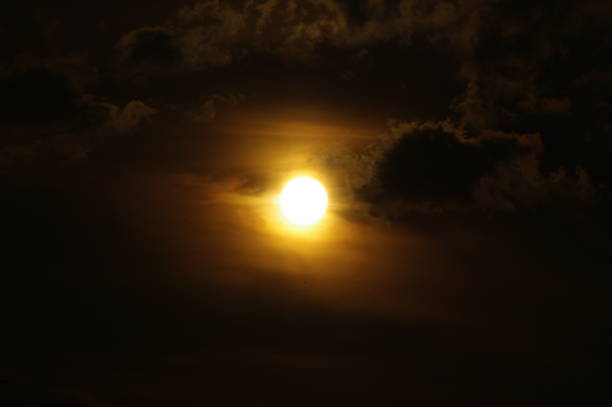 istock Sun and Clouds in the Dark and Yellow Sky 650250380