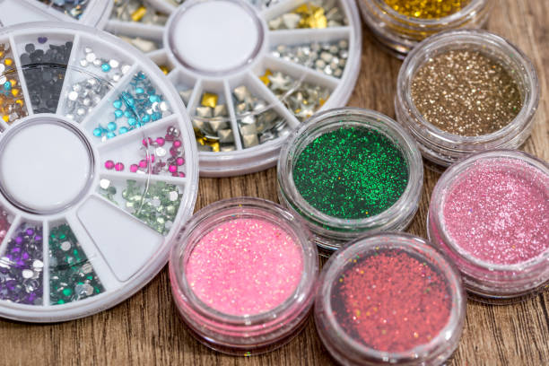 istock many round jars with  multi-colored bright glitter for nail polish. 650262540