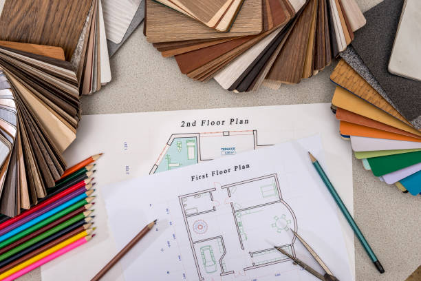 istock plan house with wooden models, pencils, pen on the table. 650278578
