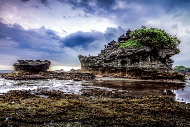 Tanah Lot Temple in Bali Indonesia Tanah Lot Temple in Bali Indonesia - nature and architecture background tanah lot sunset stock pictures, royalty-free photos & images