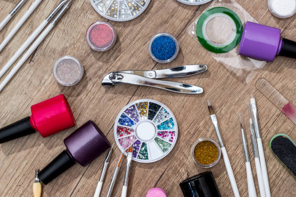 istock nail files, scissors with clippers manicure with polish bottles on desk. 650280298
