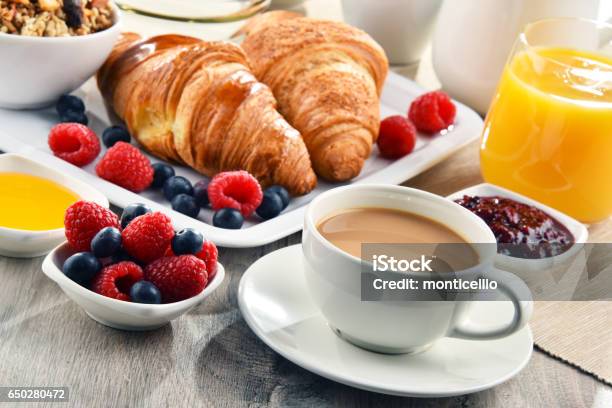 Breakfast Served With Coffee Juice Croissants And Fruits Stock Photo - Download Image Now