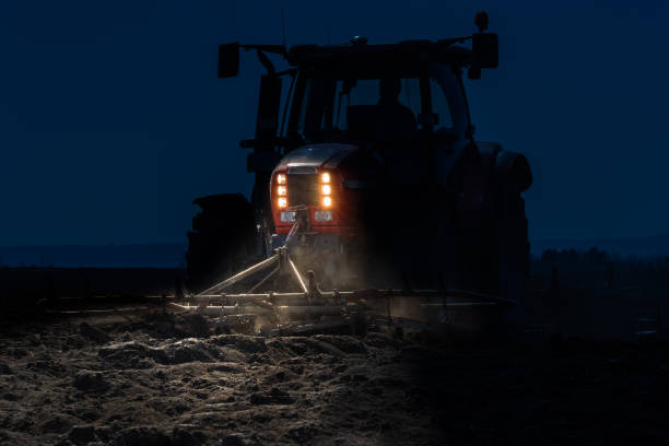 istock Tractor preparing land for sowing at night 650280786
