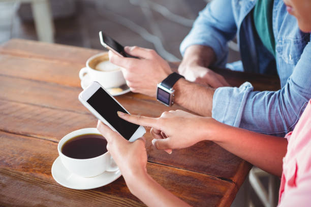 istock Hands of couple using mobile phone 650304160
