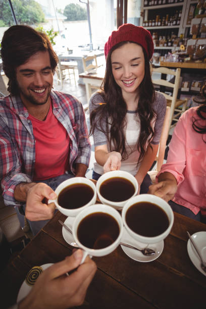 istock Group of friends toasting cup of coffee 650310538