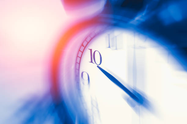 istock clock time with zoom motion blur focus at 10 o'clock, fast speed business hour concept. 650325494