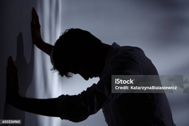 Man Leaning Hands Against Wall Stock Photo - Download Image Now - Men, Depression - Sadness, Frustration
