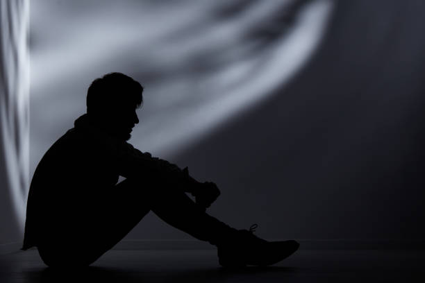 istock Abandoned man in dark room 650327078