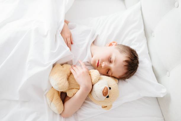istock Little boy child sleeping in bed 650343454