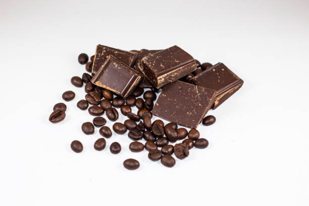 istock pieces of chocolate with coffee beans on a white background 650347084
