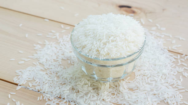 istock jasmine rice in a bowl on a wooden background. 650352702