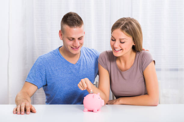 istock Money saving for happy couple 650382136