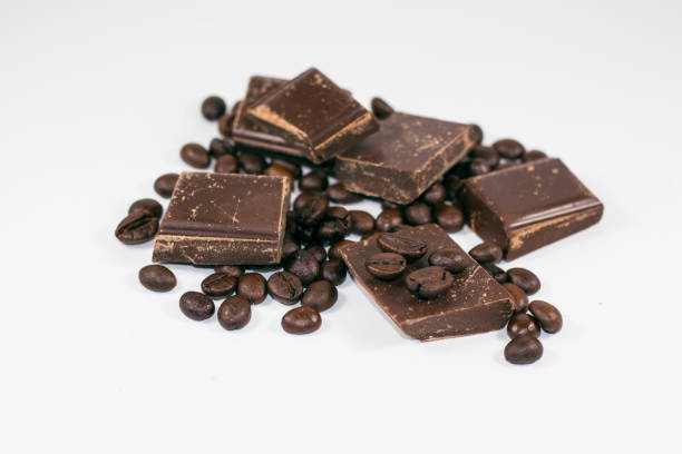 istock pieces of chocolate with coffee beans on a white background 650382212