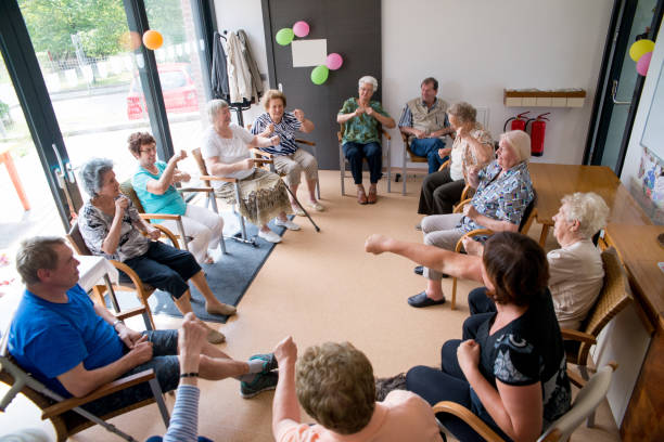 istock Seniors Doing Relaxation Exercises In The Elderly Day Care Center 650383412
