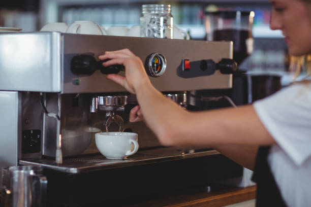 istock Smiling waitress making cup of coffee 650387752