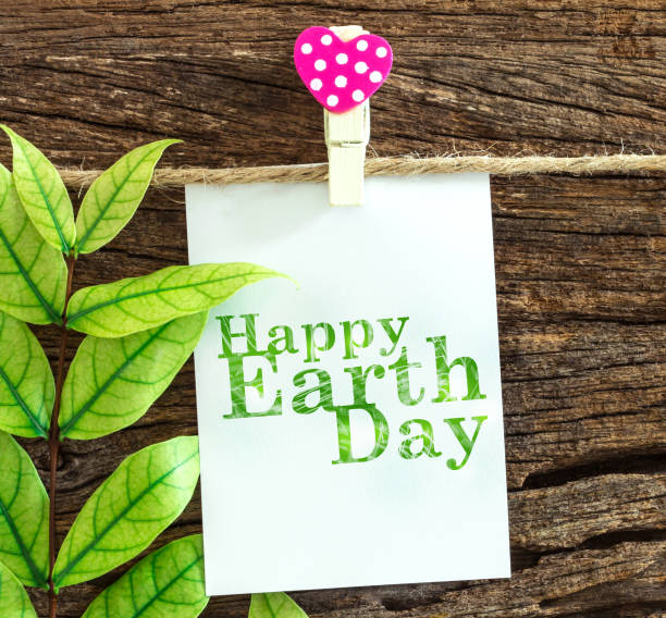 istock Happy Earth Day paper note hanging by red heart clips 650406166