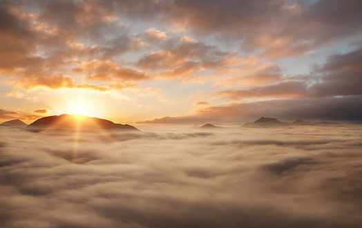 Nature background, sunset above the clouds with copy space
