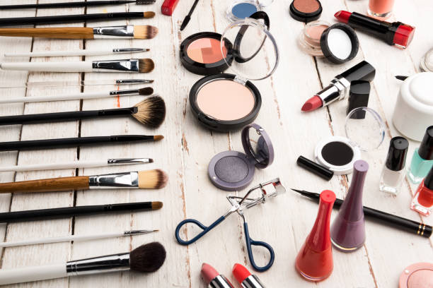 istock close up view of various brushes and cosmetics for applying makeup on table 650439786