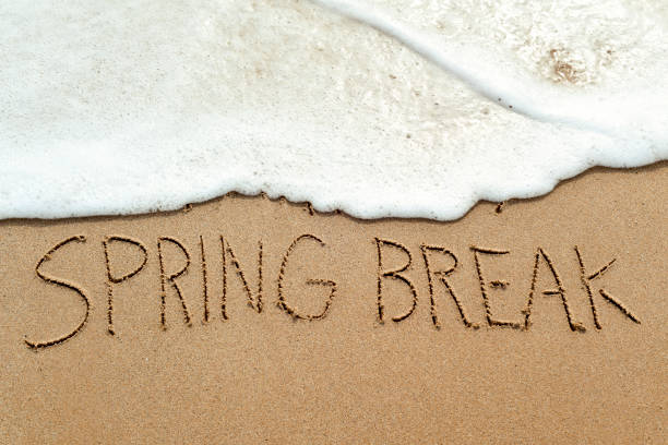 istock text spring break in the sand of a beach 650441382