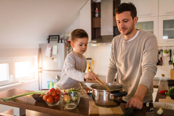 istock Father and son preparing healthy vegetable soup 650446824