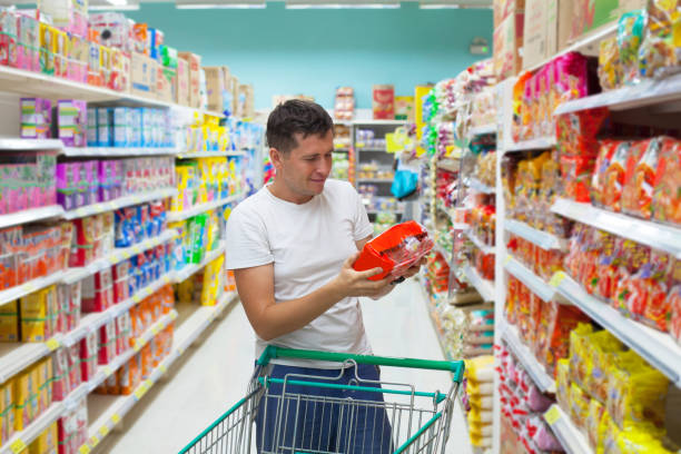 istock The guy holding some pocket with food looking at it and smiling 650448332