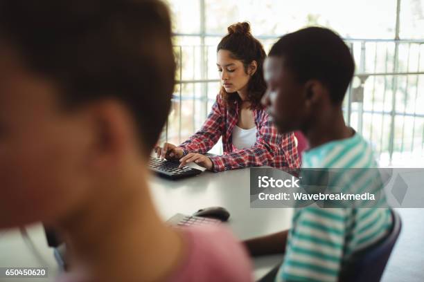 Students Using Computer In Classroom Stock Photo - Download Image Now ...