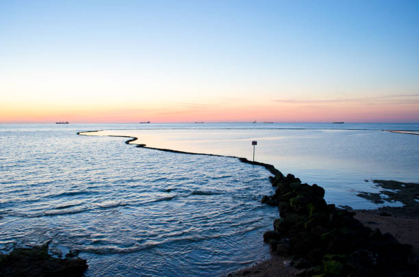 istock Sunset over the ocean. Chipiona, Spain. 650466454