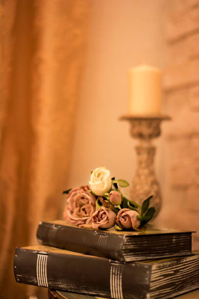 istock Vintage interior with a table with a vase and flovers and candles. 650510092